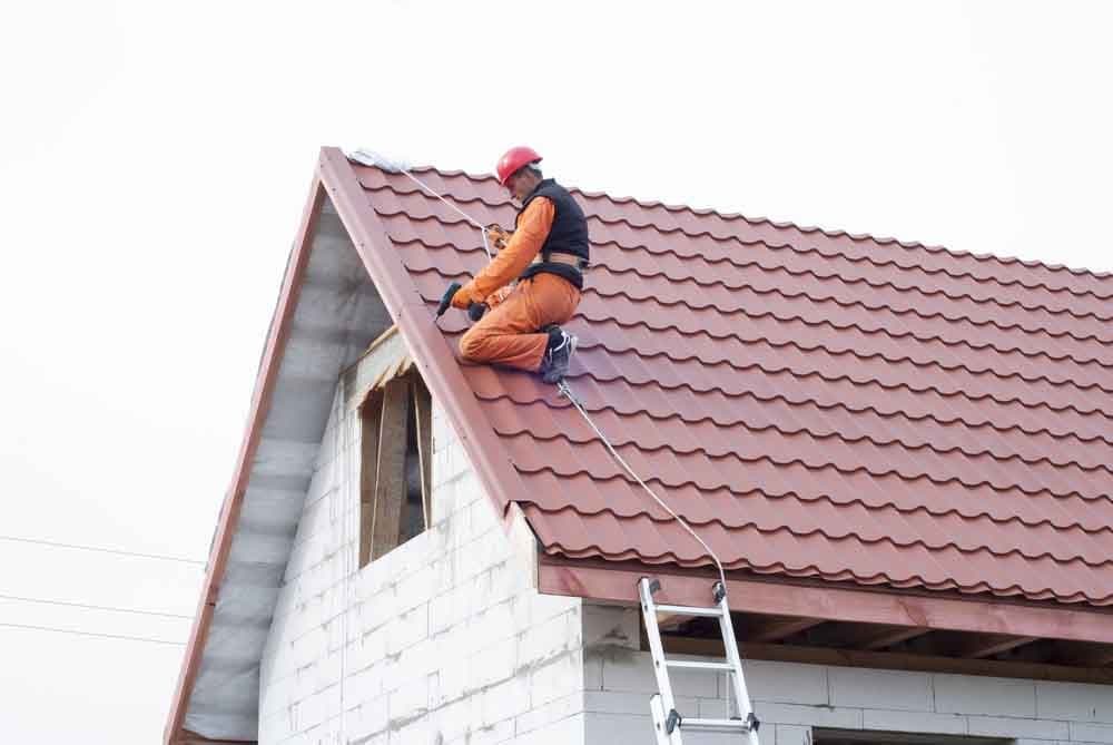 Roofer working on a residential roof