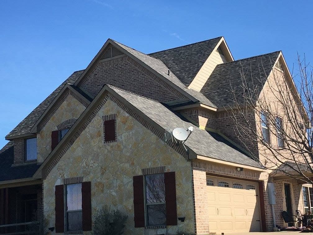 Multi-gable roofline on a completed residential roofing project