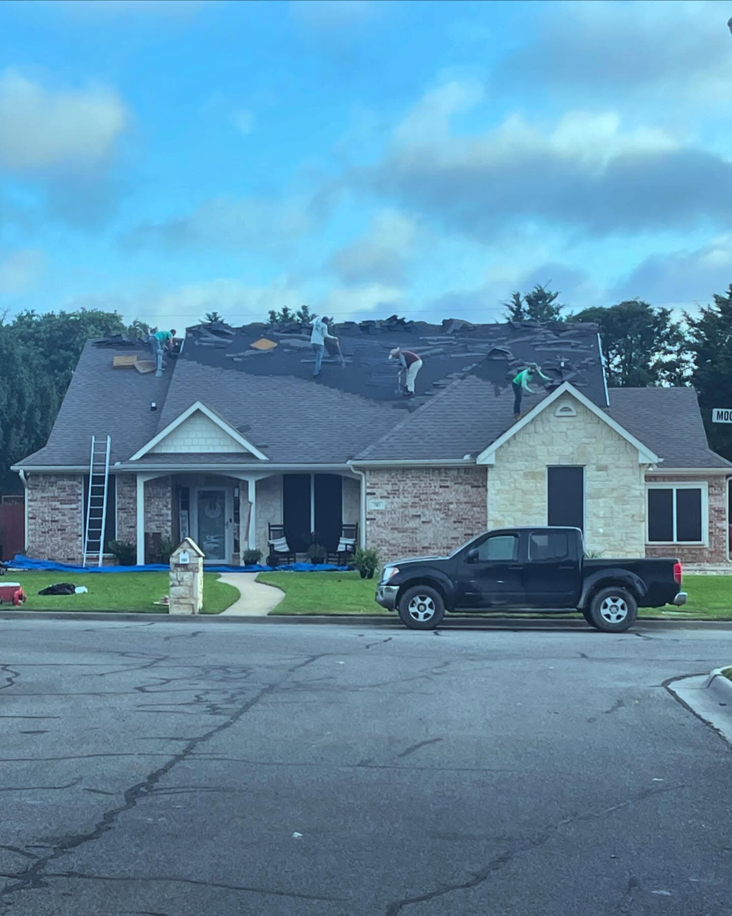 Whitetail Roofing crew tearing off an old roof during a replacement