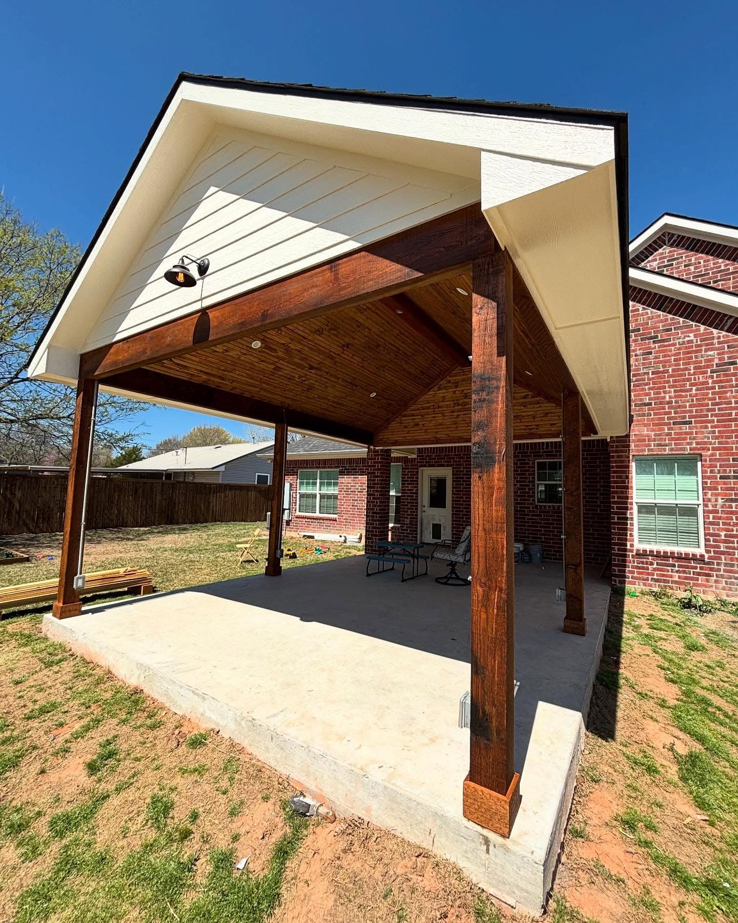 Completed patio cover addition with new roofing